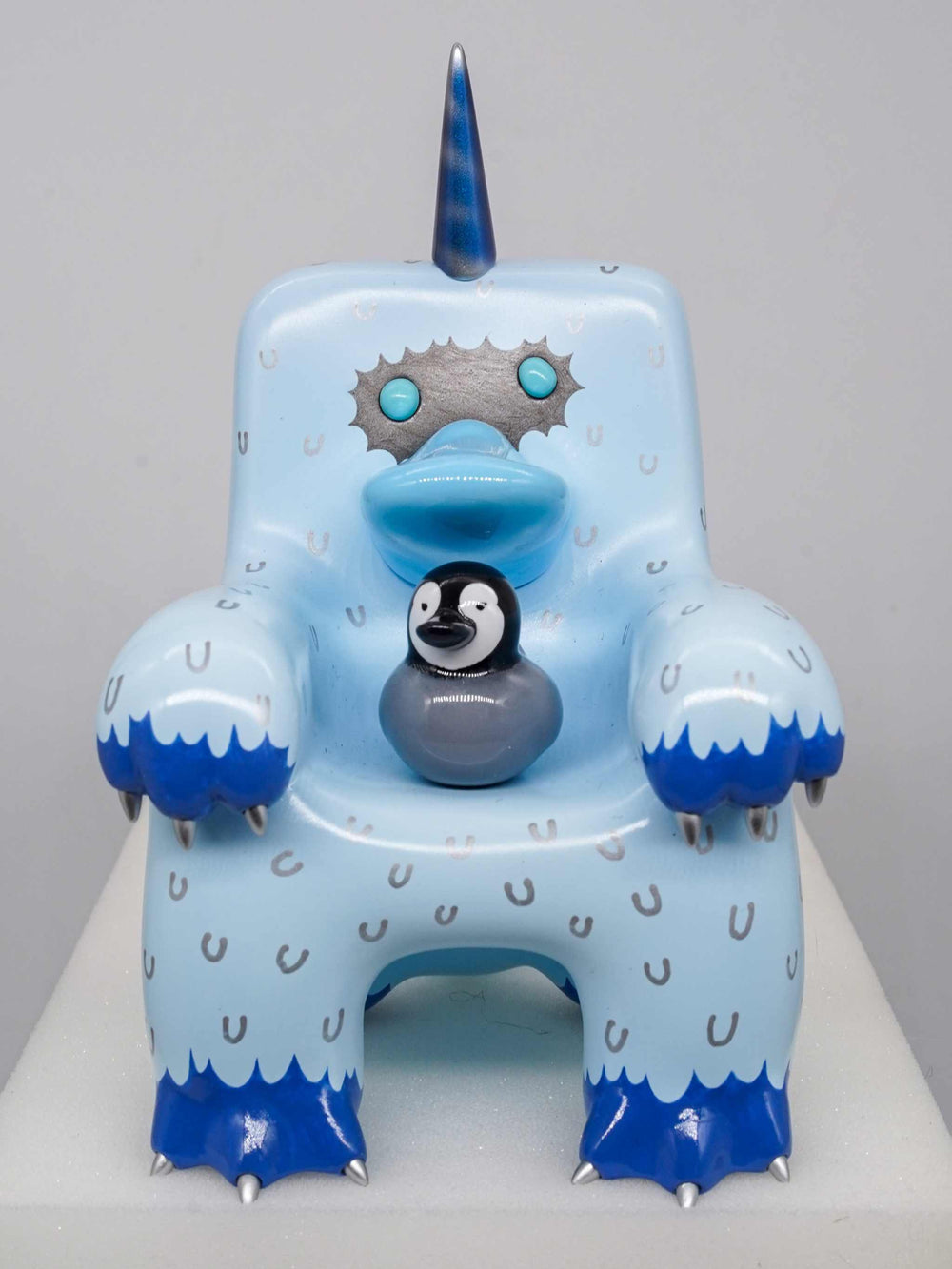 Big Yeti Platypus figure toy with magnets, blue and white with a unicorn horn design