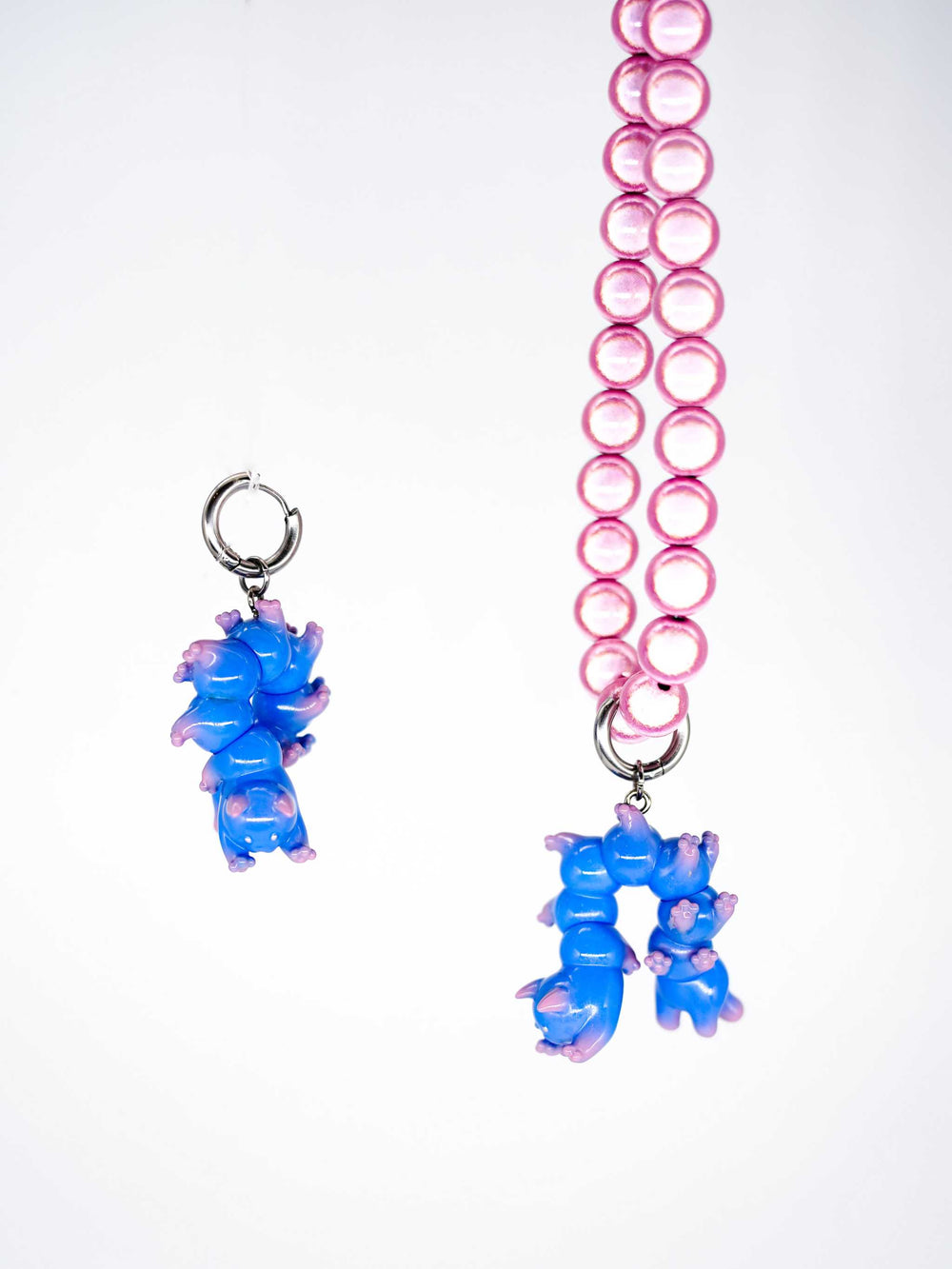 Blue cat necklace and earring set with purple gradient, featuring whimsical caterpillar design, polyurethane resin and titanium steel.