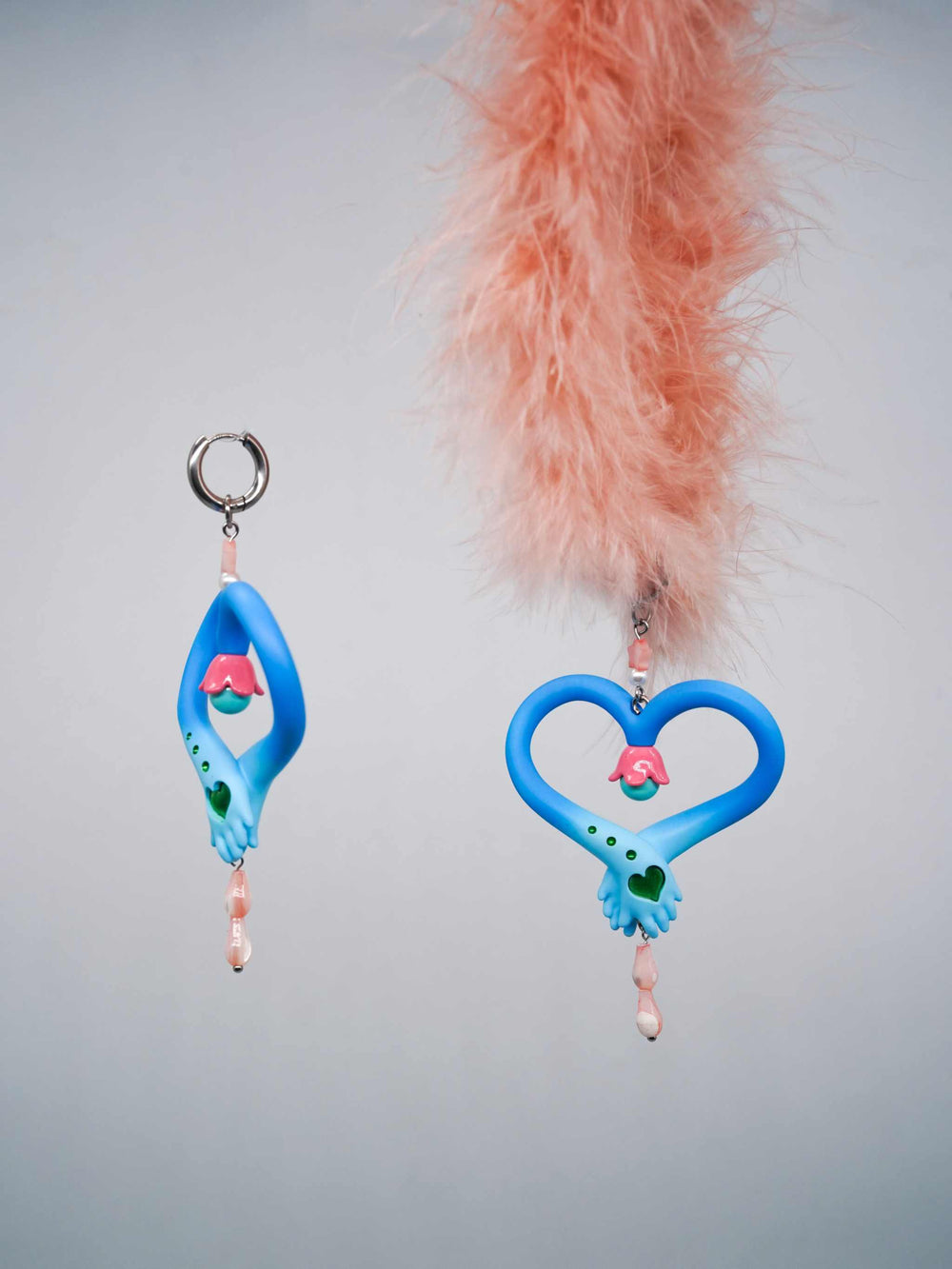 Blue and pink hands necklace and earring set inspired by a fairy's wand, made of polyurethane resin and titanium steel.