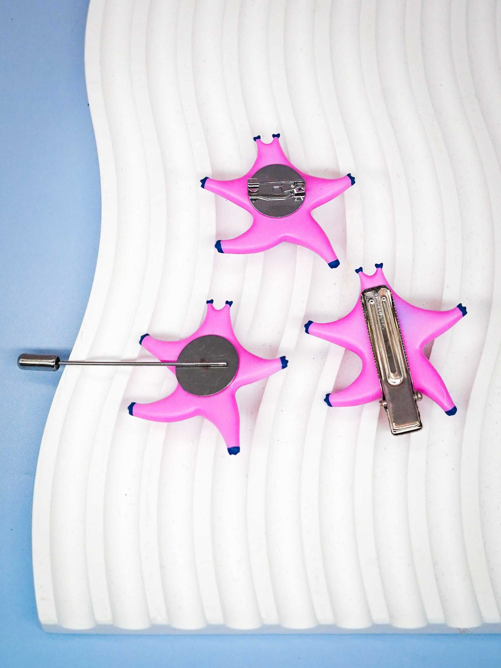 SeaStar cat hairclip and brooch set in magenta and navy, featuring pearl color blocking.