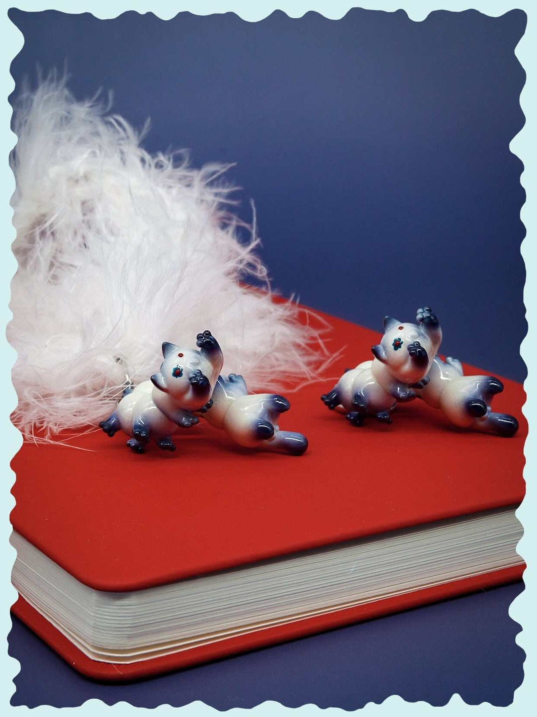 Seal point cat caterpillar necklace and earring set with blue, white porcelain colors, manmade fur, and jade beads.