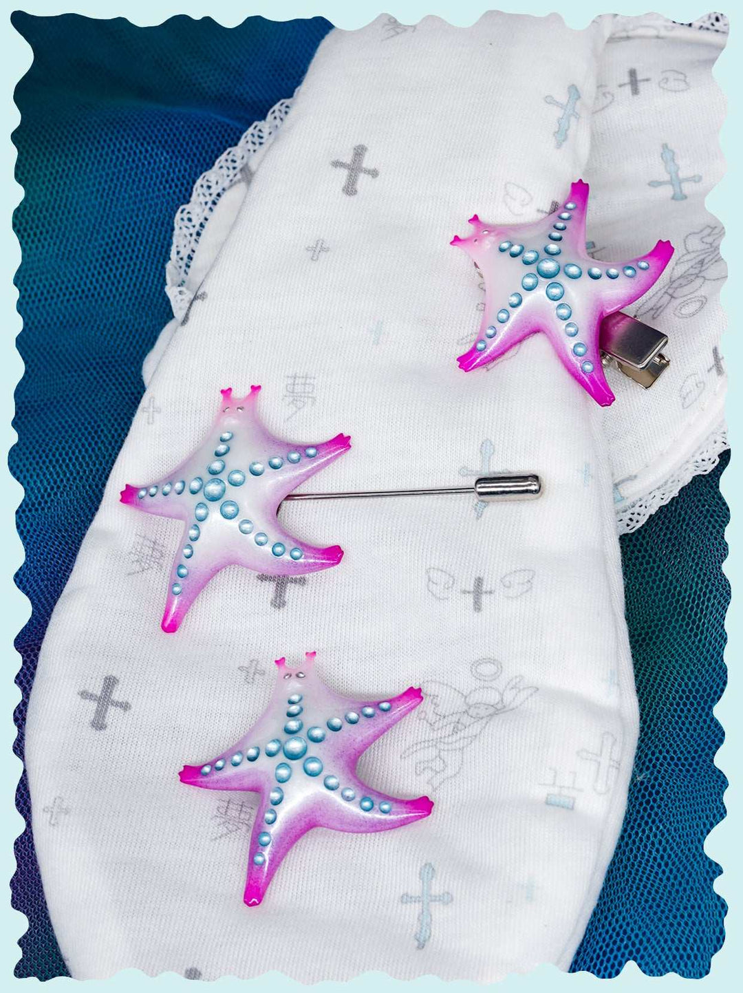 SeaStar cat hairclip and brooch in magenta and navy, pearl color blocking design.