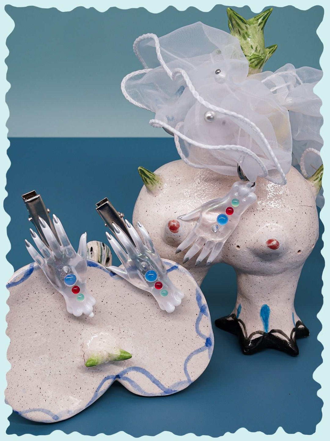 Colorful white monster hand earrings, necklace, and hair clips jewelry set with playful multicolored details