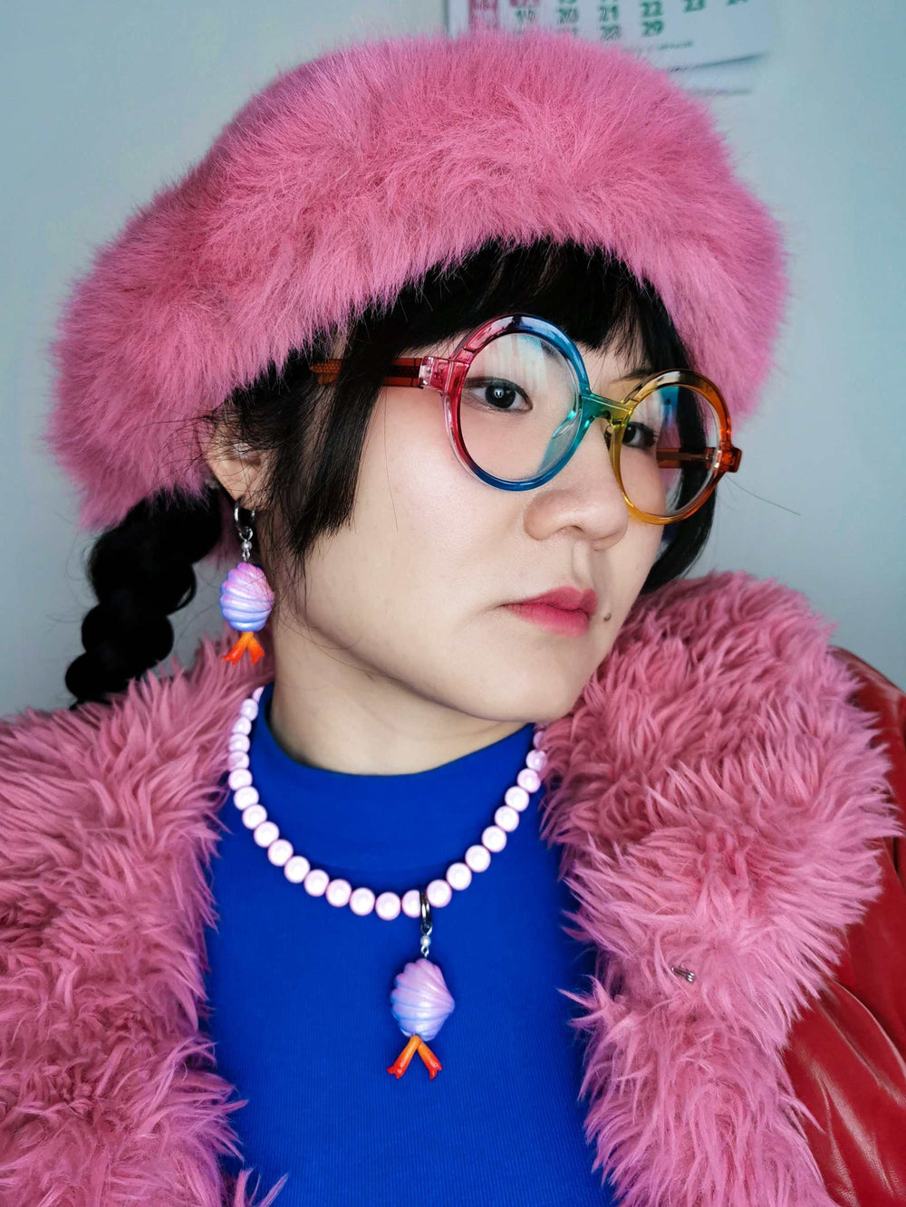 Mini shy clam fairy wild purple color necklace & earring set, featuring polyurethane resins and titanium steel, worn by person with pink outfit.