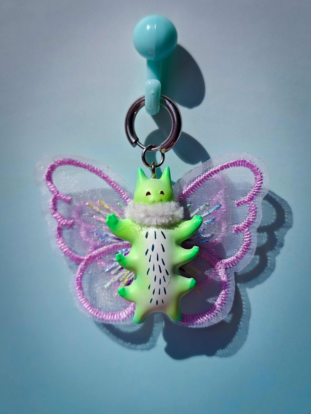 Calico catcaterpillar necklace and earring set with ears design.