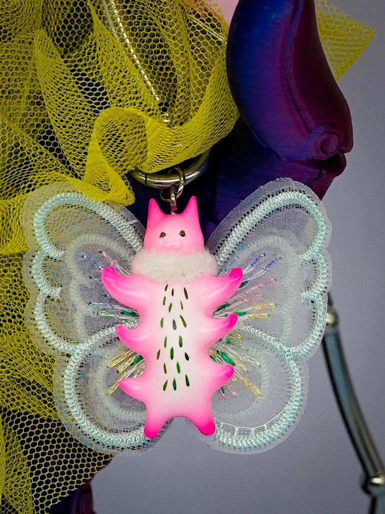 Butterfly cat pendant with fur snood, flamingo pink body, mint green wings, and intricate details.