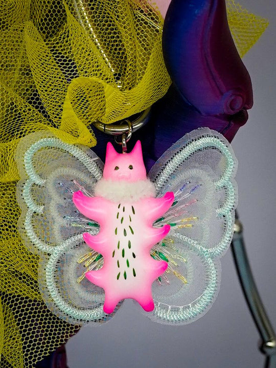 Butterfly cat pendant with fur snood, flamingo pink body, mint green wings, and intricate details.