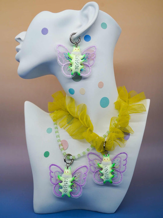 Calico catcaterpillar necklace and earring set with whimsical design and multiple ears, featuring polyurethane resins and titanium steel.