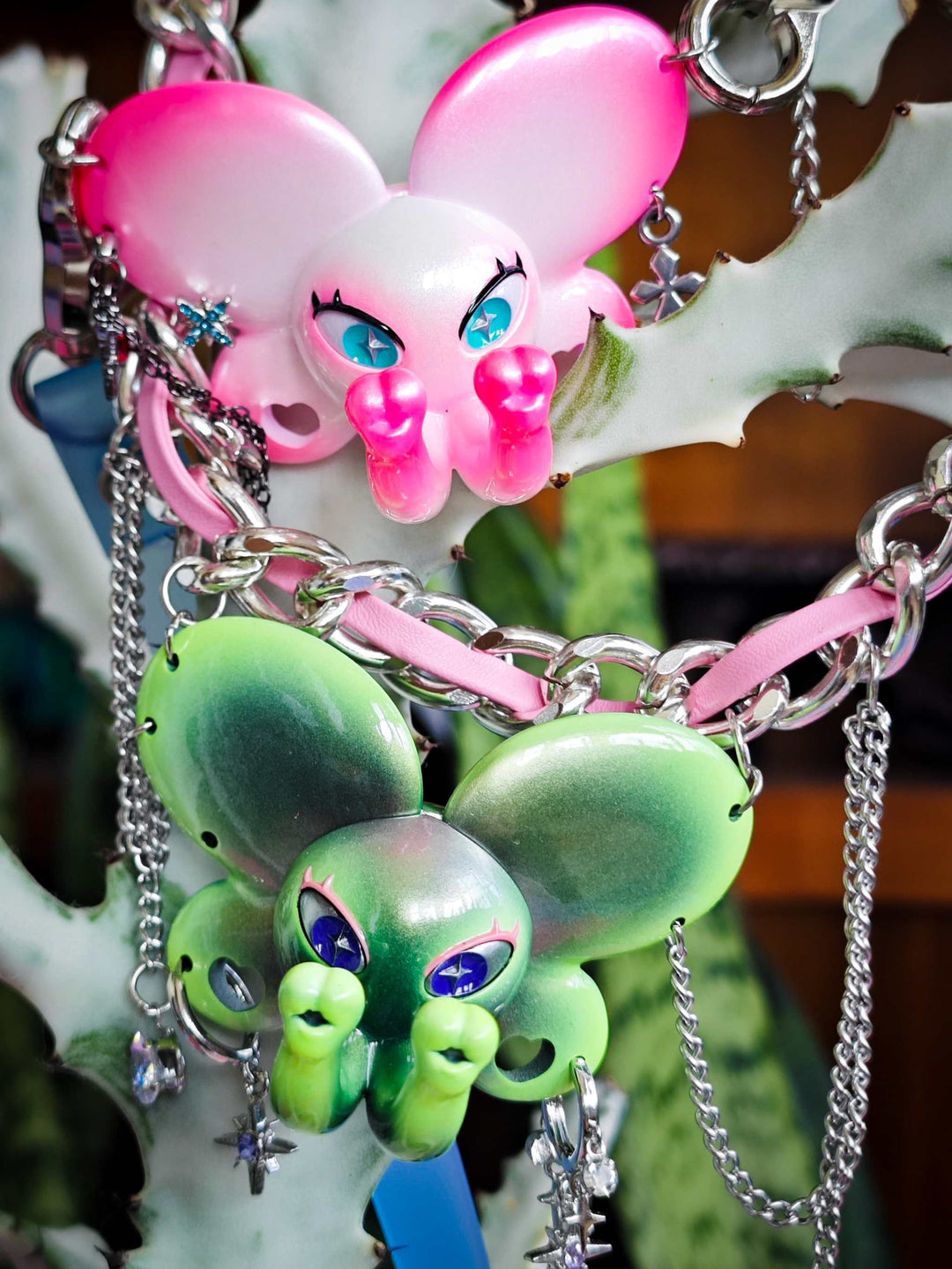 Twin-Trunk Diva Elephant Necklace in alien apple green with two trunks and starry eyes