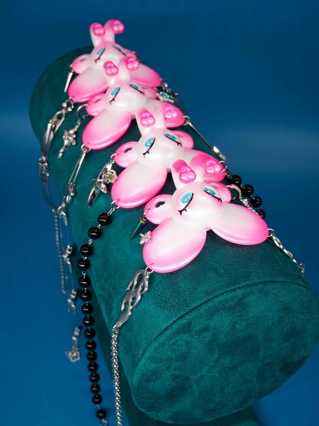Twin-Trunk Diva Elephant Necklace in pink pearl white with two trunks and blue-green starry eyes