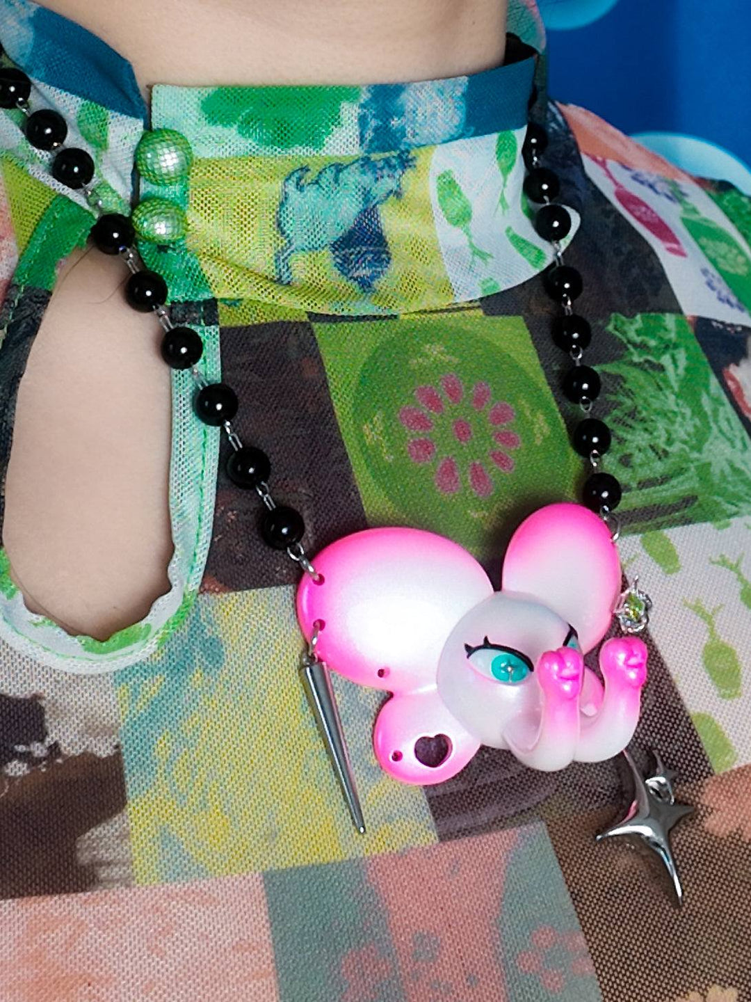 Twin-Trunk Diva Elephant Necklace in pink pearl white with dual trunks and sparkling blue-green star pupils
