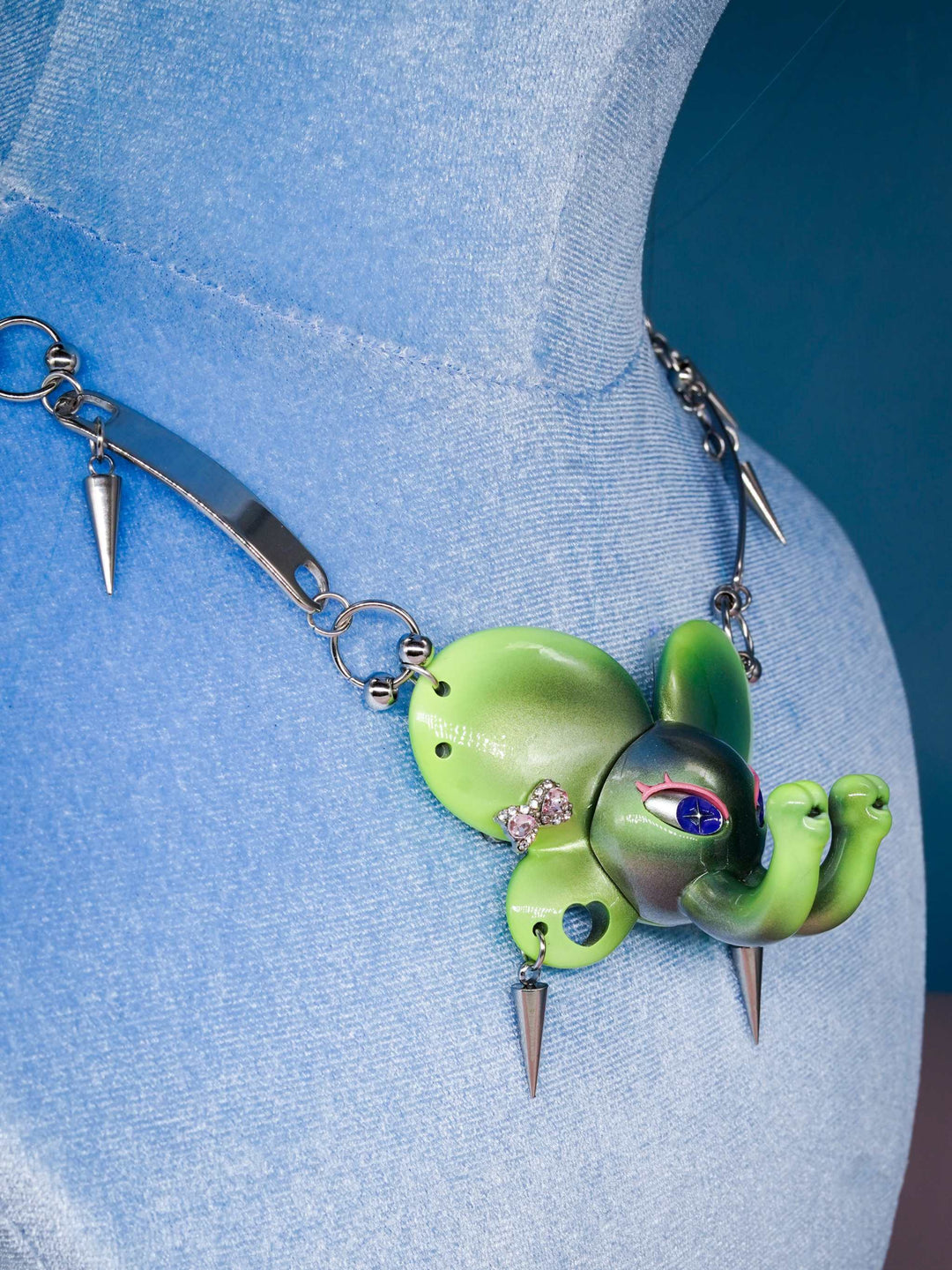 Twin-Trunk Diva Elephant Necklace in metallic alien apple green with two trunks and starry eyes