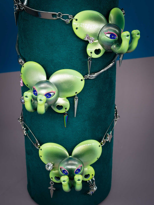 Twin-Trunk Diva Elephant Necklace in metallic alien apple green with two trunks and starry eyes