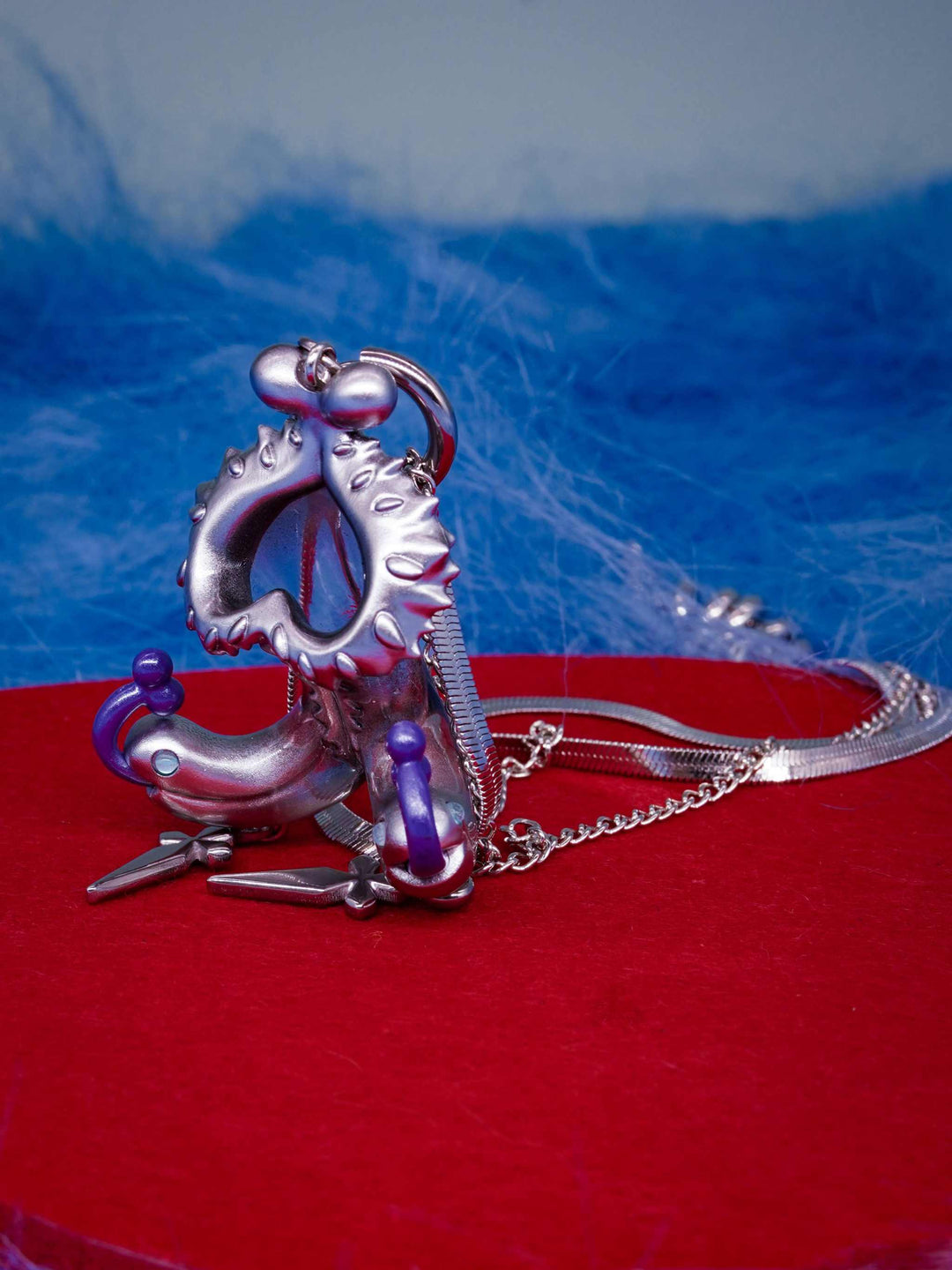 Twin-Headed Pitcher Serpent Earrings with violet tendrils and silver metallic details inspired by pitcher plant