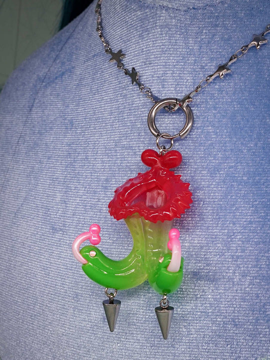Twin-headed pitcher serpent earrings and pendant in translucent cherry red, acid green, and bubblegum pink with metal spikes by Acid Candy