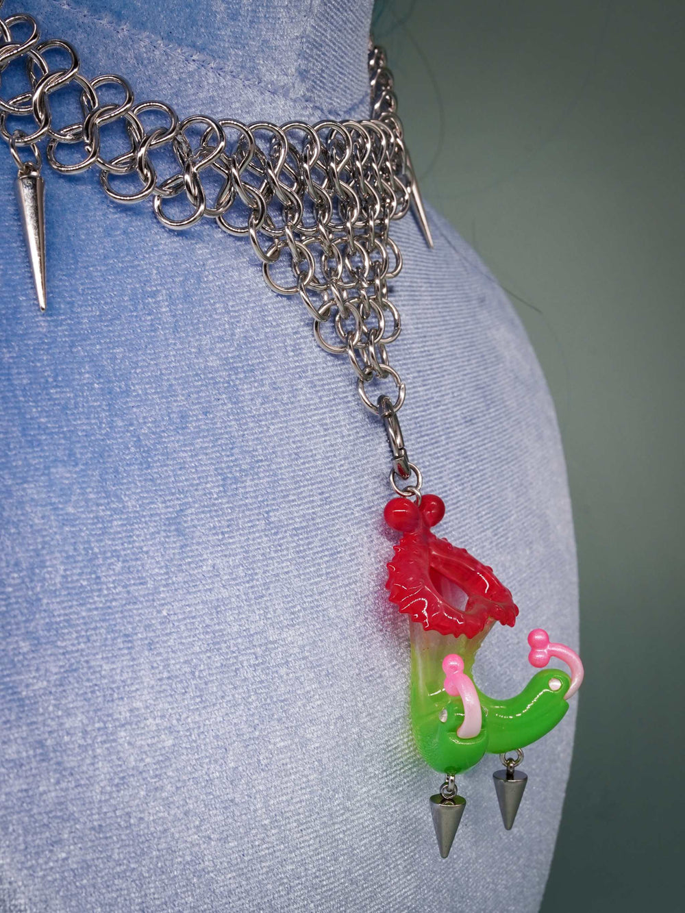 Twin-headed pitcher serpent earrings and pendant with translucent red, green, and pink colors inspired by pitcher plants and serpents