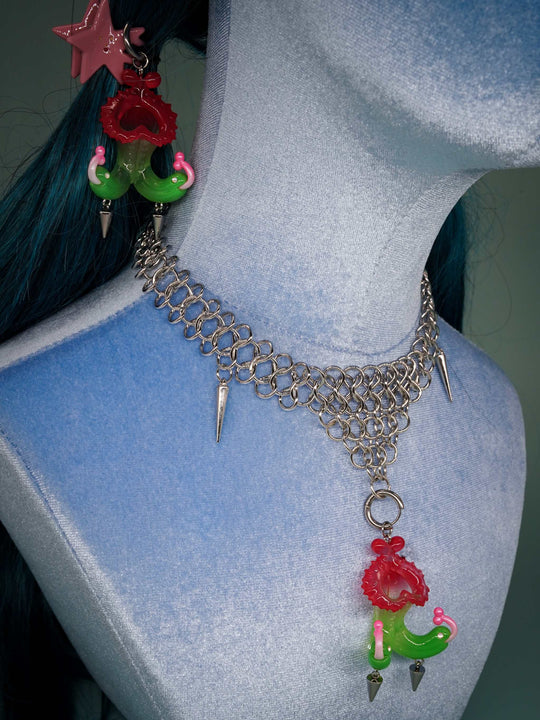 Twin-headed pitcher serpent earrings in translucent cherry red, acid green, and bubblegum pink with metal spikes and titanium steel accents