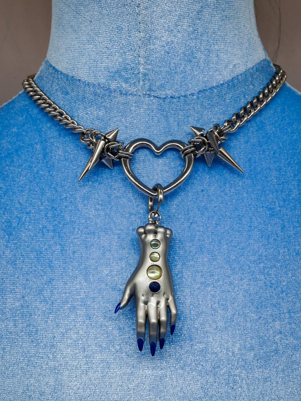 Moonlight Silver Fairy Goblin Hands necklace and earrings in metallic silver with blue gradient nails and gem details
