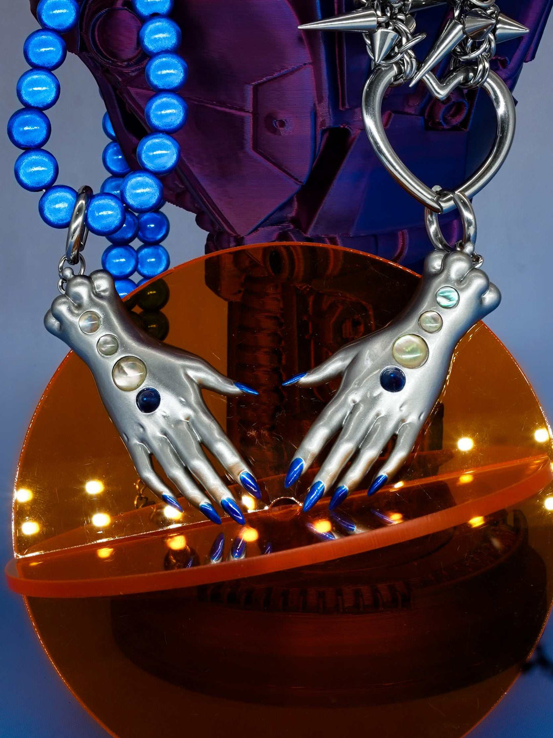 Moonlight Silver Fairy Goblin Hands necklace and earrings with metallic silver finish and blue gradient nails