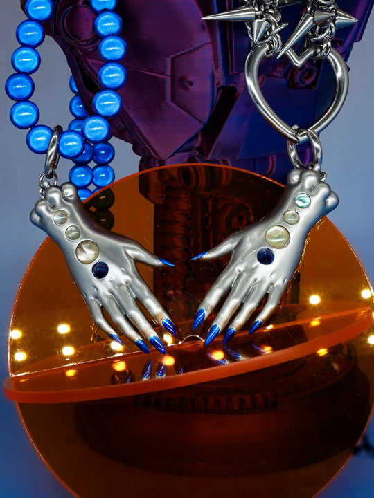 Moonlight Silver Fairy Goblin Hands necklace and earrings with metallic silver finish and blue gradient nails
