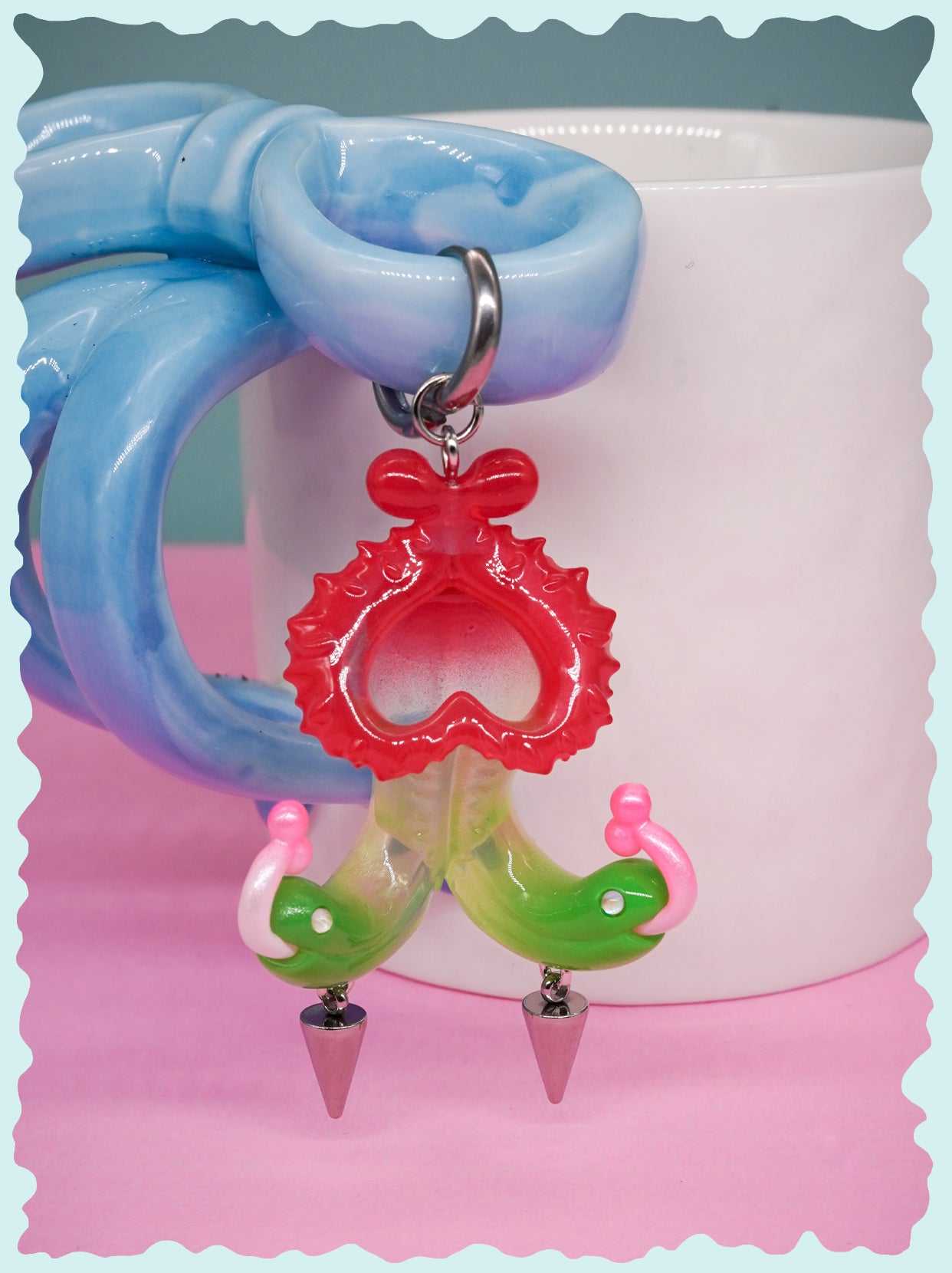 Twin-headed pitcher serpent earrings and pendant in translucent red, green, and pink with metal spikes by Acid Candy
