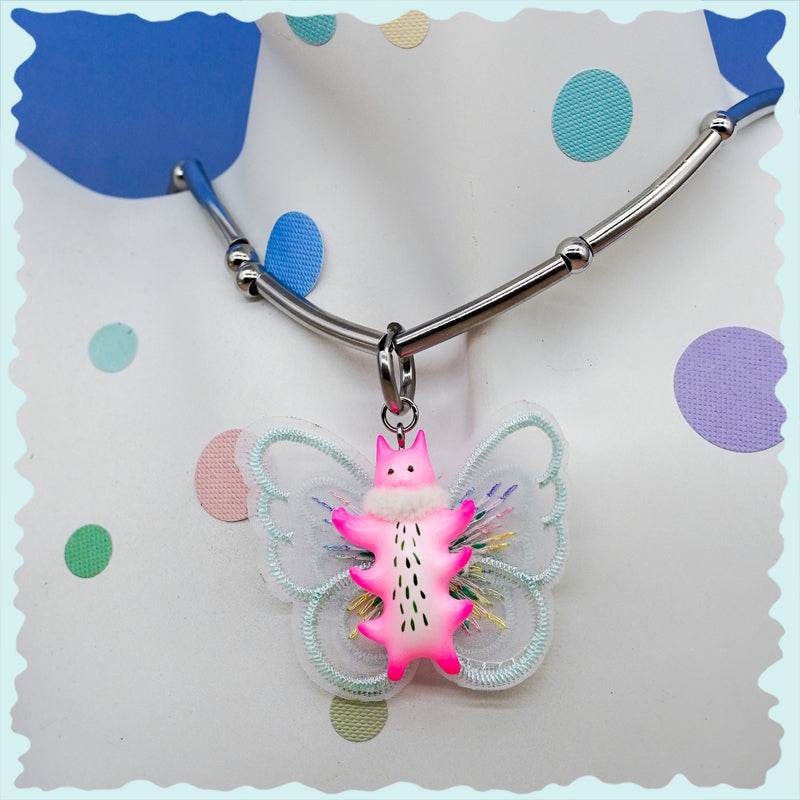 Butterfly cat necklace with flamingo pink body and mint green wings.