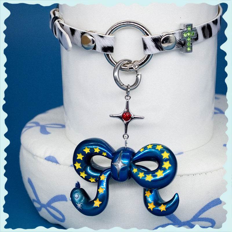 Blue metal snake bowtie necklace and earring set with felt tongue detail