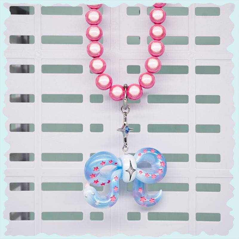 Ice blue snake bowtie necklace with pink stars and laser bead chain