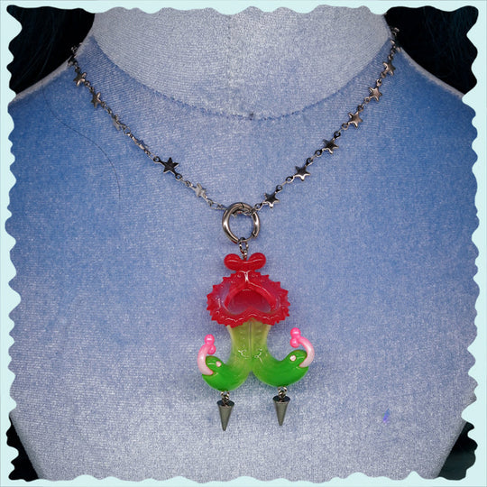 Twin-headed pitcher serpent earrings in cherry red, acid green, and bubblegum pink with metal spikes by Acid Candy