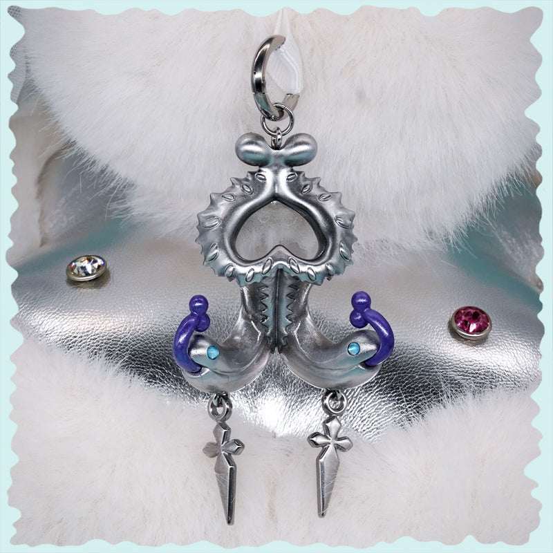 Twin-headed pitcher serpent earrings with violet tendrils and silver metallic details