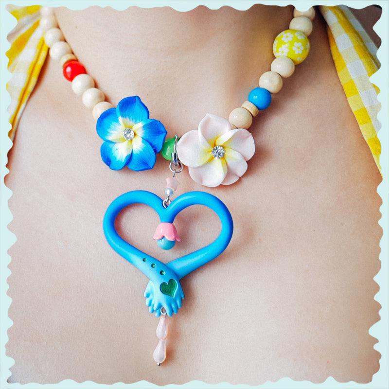 Blue and pink hands necklace with fairy wand design and pearl bead accents